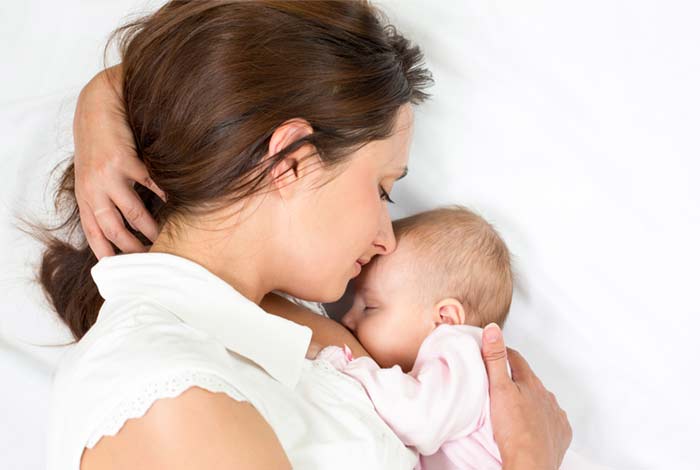 two month breast feeding halves the risk of cot death according to new research